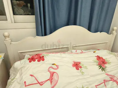 Double white bed with matress and 2 bedsides tables