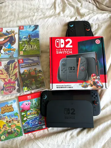 Nintendo Switch 2 with dock, 6 games and extra controllers - used
