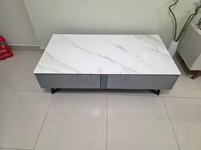 Modern white marble-top coffee table with storage drawer