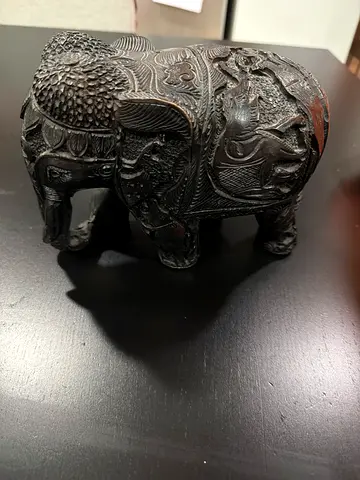 Hand-carved Black Wooden Elephant Figurine with Intricate Detailing