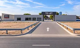 40,000 Sq Ft commercial plot with shaded parking, offices, Auto garage in Umm Ramool in main road.
