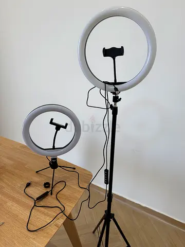 Two adjustable LED ring lights with phone holders and tripods