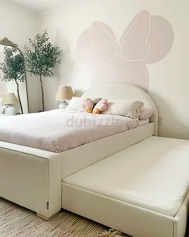 Cream upholstered double bed with trundle - good condition