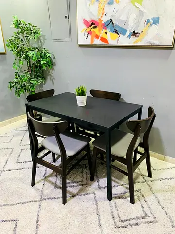 IKEA-style 4-seater dining table with chairs - dark wood/black finish
