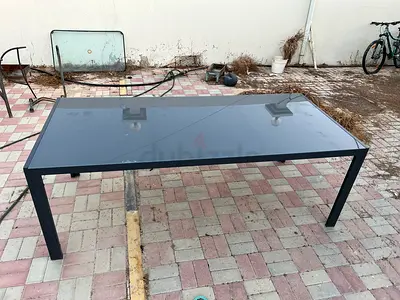 Modern black metal outdoor/indoor glass-top dining table - 6 seater size
