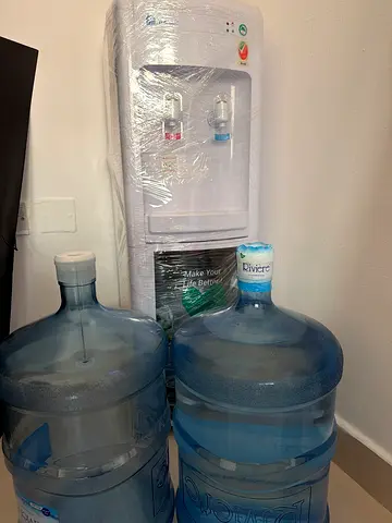 Water dispenser with 2 large 19L water bottles - good working condition