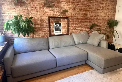 Crate and Barrel gray lshape sofa with ottoman storage space