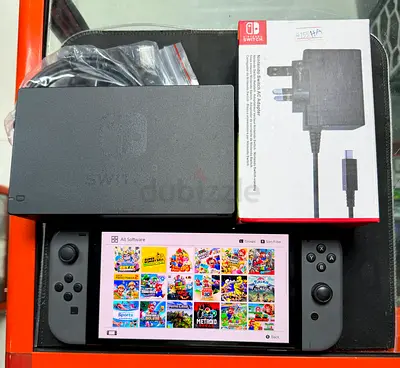 Nintendo Switch OLED with games with dock, charger and Joy-Con - Good condition