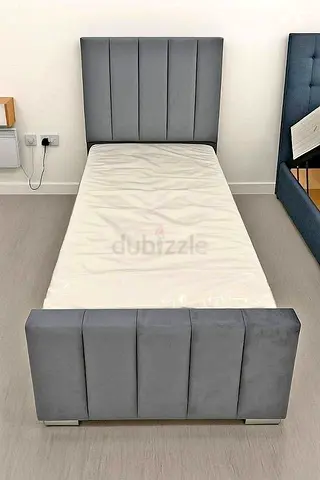 Single grey upholstered bed frame with headboard and footboard