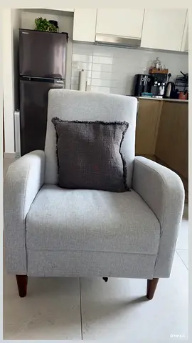 Light grey single-seater armchair with wooden legs — good condition