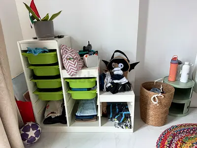 White modular storage unit with green drawers and open shelves — good condition pick up in Arjan