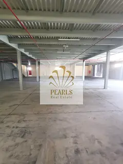 Large Warehouse for Rent in Al Jurf Industrial 2, Mezzanine, Two Main Road Entrances, Ideal for Stor