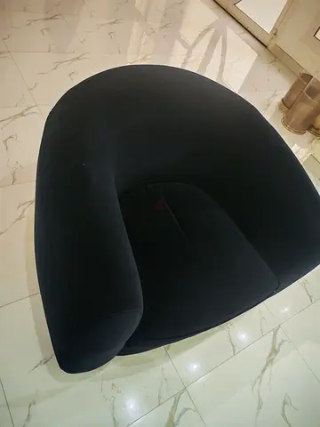 Modern curved black lounge armchair - comfortable single seat