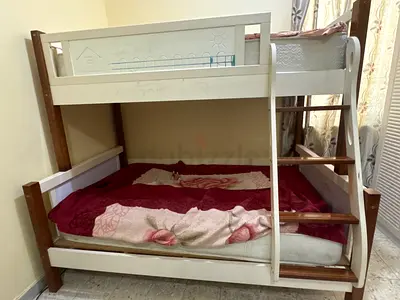 White wooden bunk bed with ladder - sturdy double/single setup
