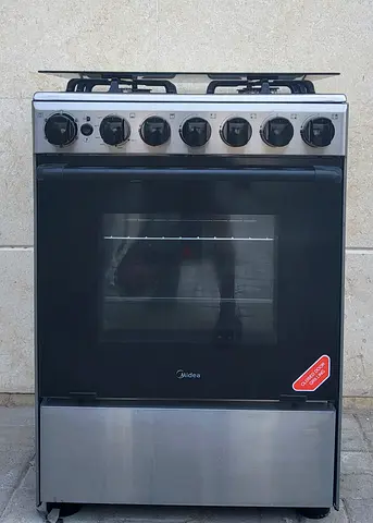 Midea gas cooker 60X60 cm with 4 burners perfect working condition