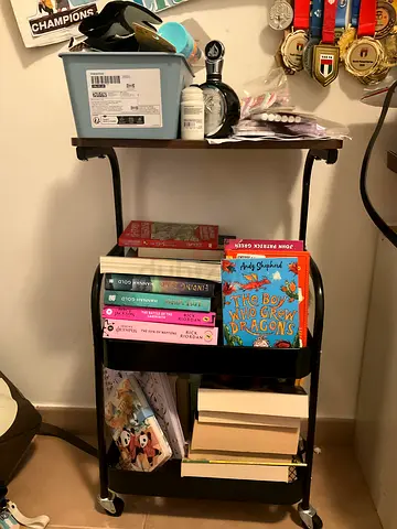 Small black book shelf on wheels 2 levels