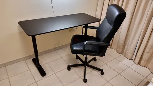 Adjustable Black Office Desk with Ergonomic Black Leather Chair - Good Condition