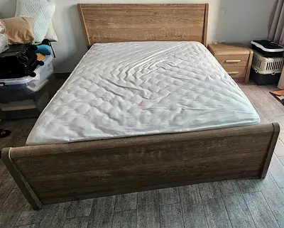 Queen size bed frame (excluding mattress) with matching nightstand - oak finish