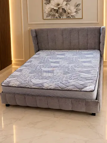 Grey upholstere bed with headboard - good condition