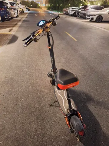 Adult electric scooter with seat — good condition, ready to ride
