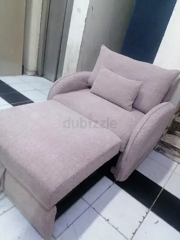 Selling single seater sofa bed with folding table