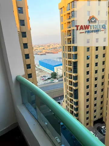 Two-bedroom apartment with a living room and a maid's room for annual rent in Ajman, with a large a