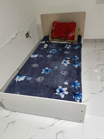 Single wooden bed frame with headboard - good condition