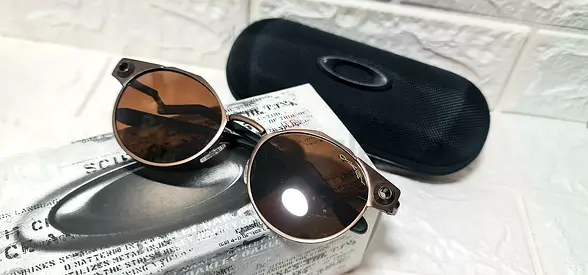 Sunglass Oakley Deadbolt Metal Bronze Frame w/ Rose Gold Iridium Prizm Lens