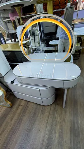 Modern dressing table with round illuminated mirror