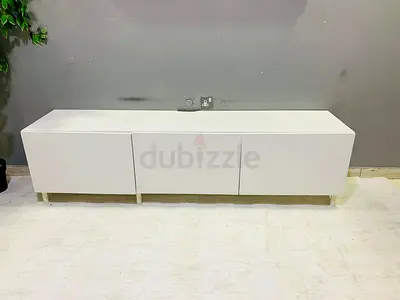 Low white TV cabinet / media console with three doors