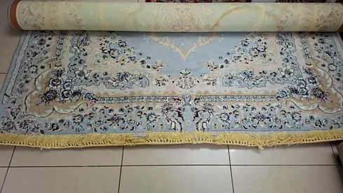 Light blue Persian-style area rug - good condition, 300cm x 200cm (approx.)