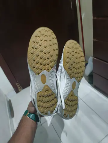 Used white indoor turf shoes - size not specified, good condition