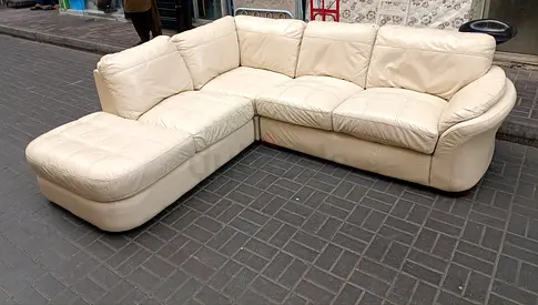 Cream L-shaped Leather Sofa with Ottoman - Good Condition