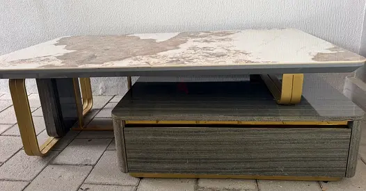 Low modern coffee table with storage drawer and marble-effect top. Small crack inside.