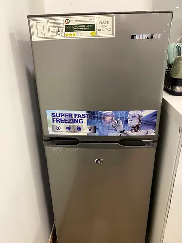 Used single-door refrigerator with freezer compartment - good working condition