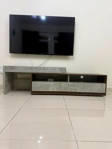 Modern low TV entertainment unit with 55 inch TV Phillips