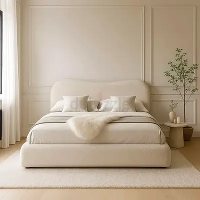 Modern upholstered king-size bed with plush headboard and base