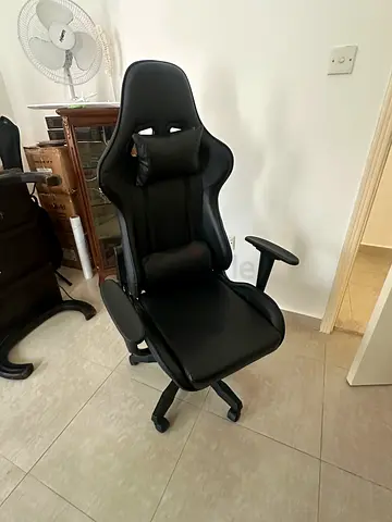 Black ergonomic gaming/office chair with head and lumbar support