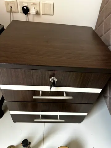 Dark wood two-drawer bedside table with lock