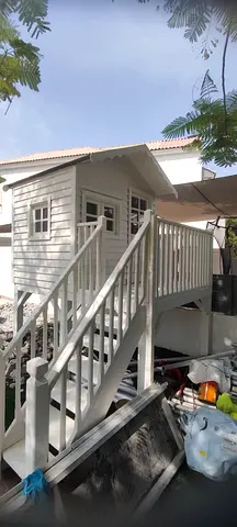 Custom-Built Elevated Wooden Kids Playhouse with Stairs & Balcony
