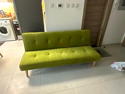 Green 3-seater sofa bed / futon in good condition