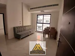 Luxury 2-Bedroom Apartment with Living Room | Al Rumaila 1 | Annual Rent | Central A/C | Unpaved Par