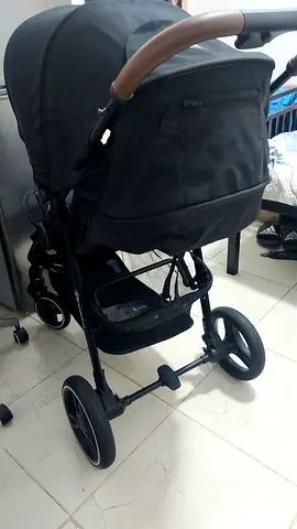 Lightly used full-size baby stroller with large canopy and storage basket