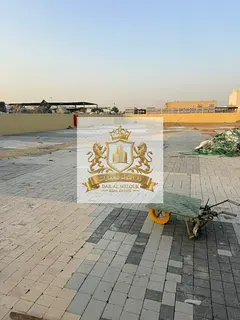 Fenced land plot (enclosed yard) for rent in Sharjah... Located in the Old Sajaa Industrial Area... 