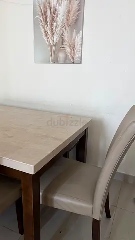 Six seater solid dining table with cream marble top