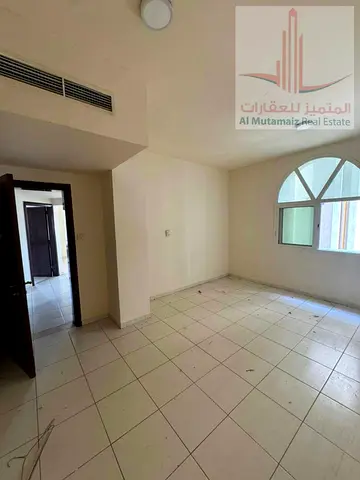 One-bedroom apartment with a living room in the Al Rashidiya 3 area, located on Old Al-Muroor Road opposite Grand Mall—an excellent location.