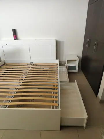 Ikea White wooden storage bed frame with drawers and headboard
