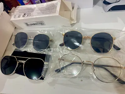 Collection of 4 assorted sunglasses and eyeglass frames - never used