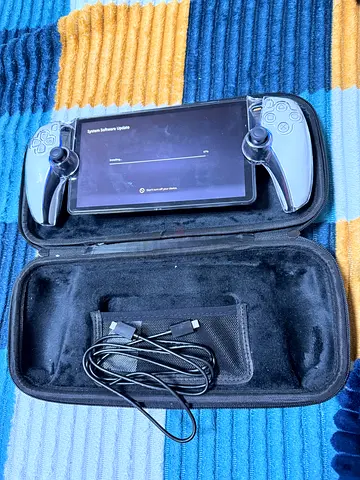 Handheld gaming controller with built-in screen in protective case — works fine