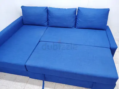 Blue L-shaped Sofa Bed with Storage - Good Condition
